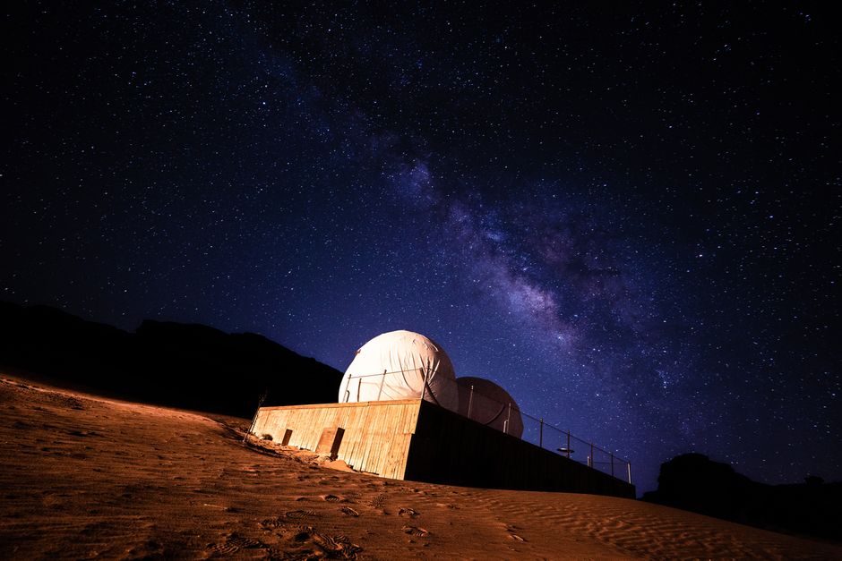 Stunning view of the Milky Way galaxy above a desert observatory under a starry night.